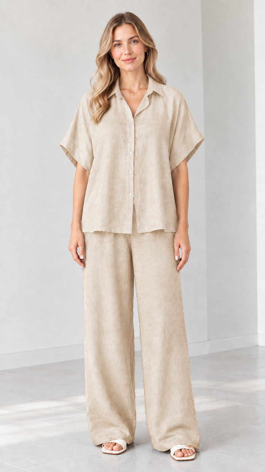 Model wearing Beige short-sleeve button-down shirt and wide-leg trousers