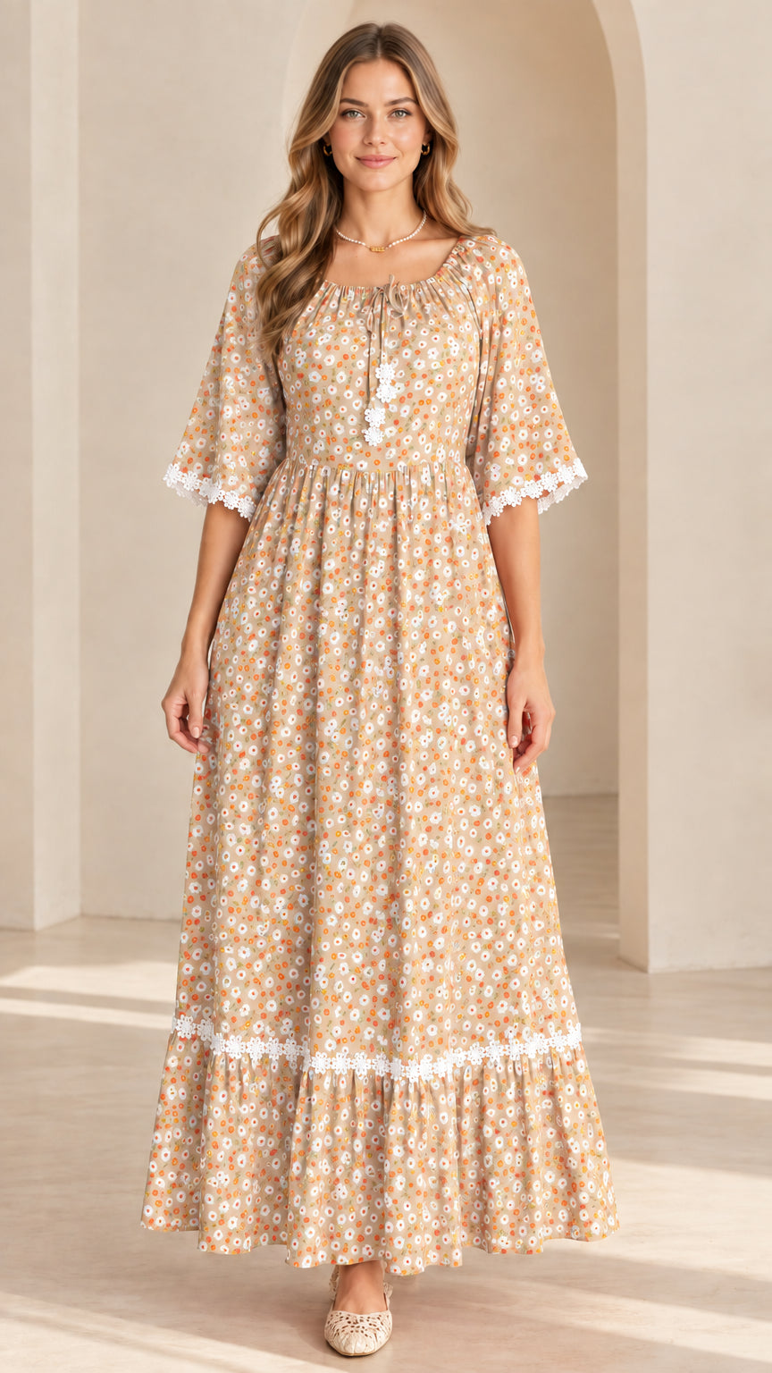 Front view of model wearing beige tan floral lace trimmed maxi dress