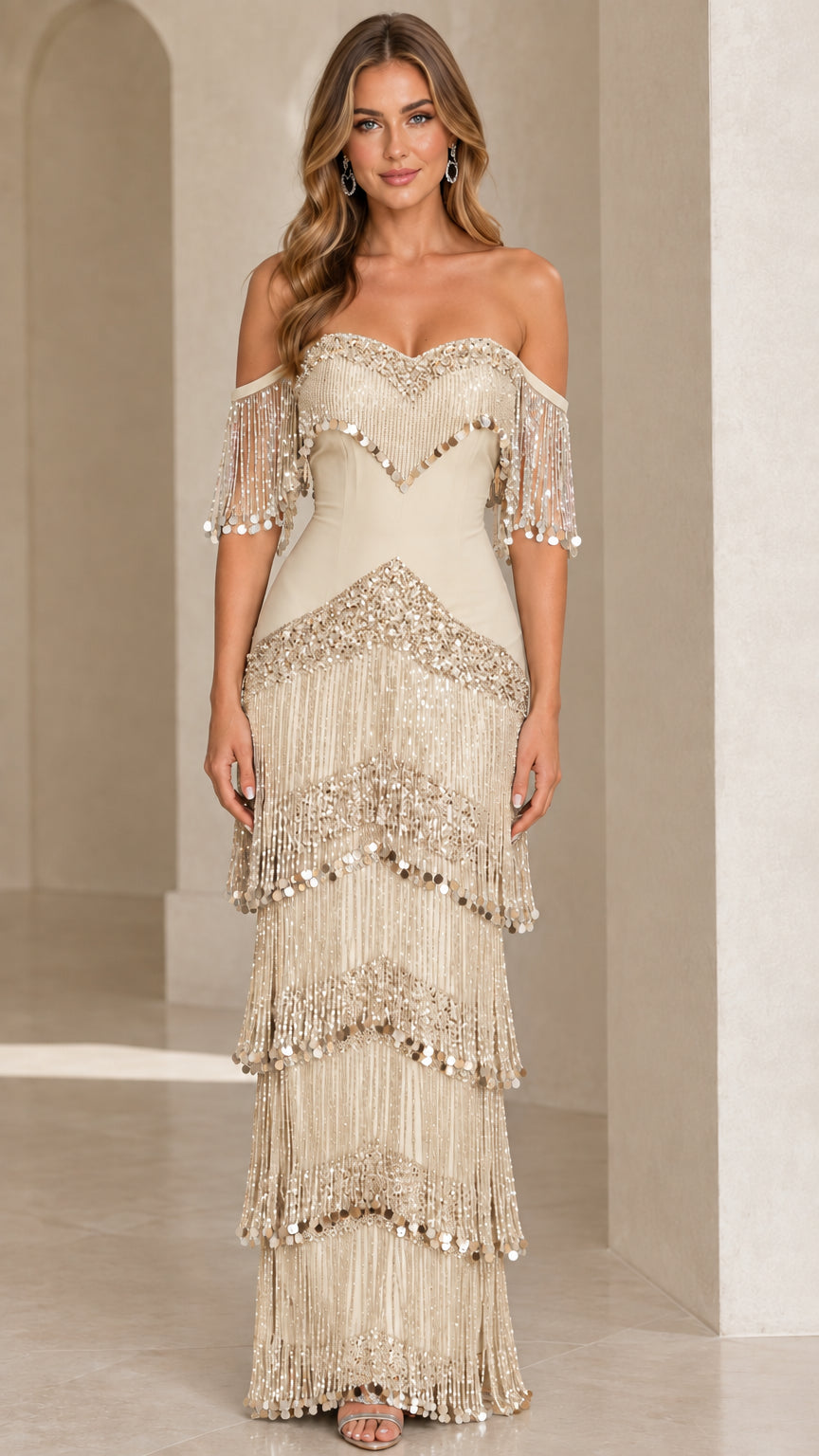 Full-length view of champagne gold off-the-shoulder tiered fringe maxi gown