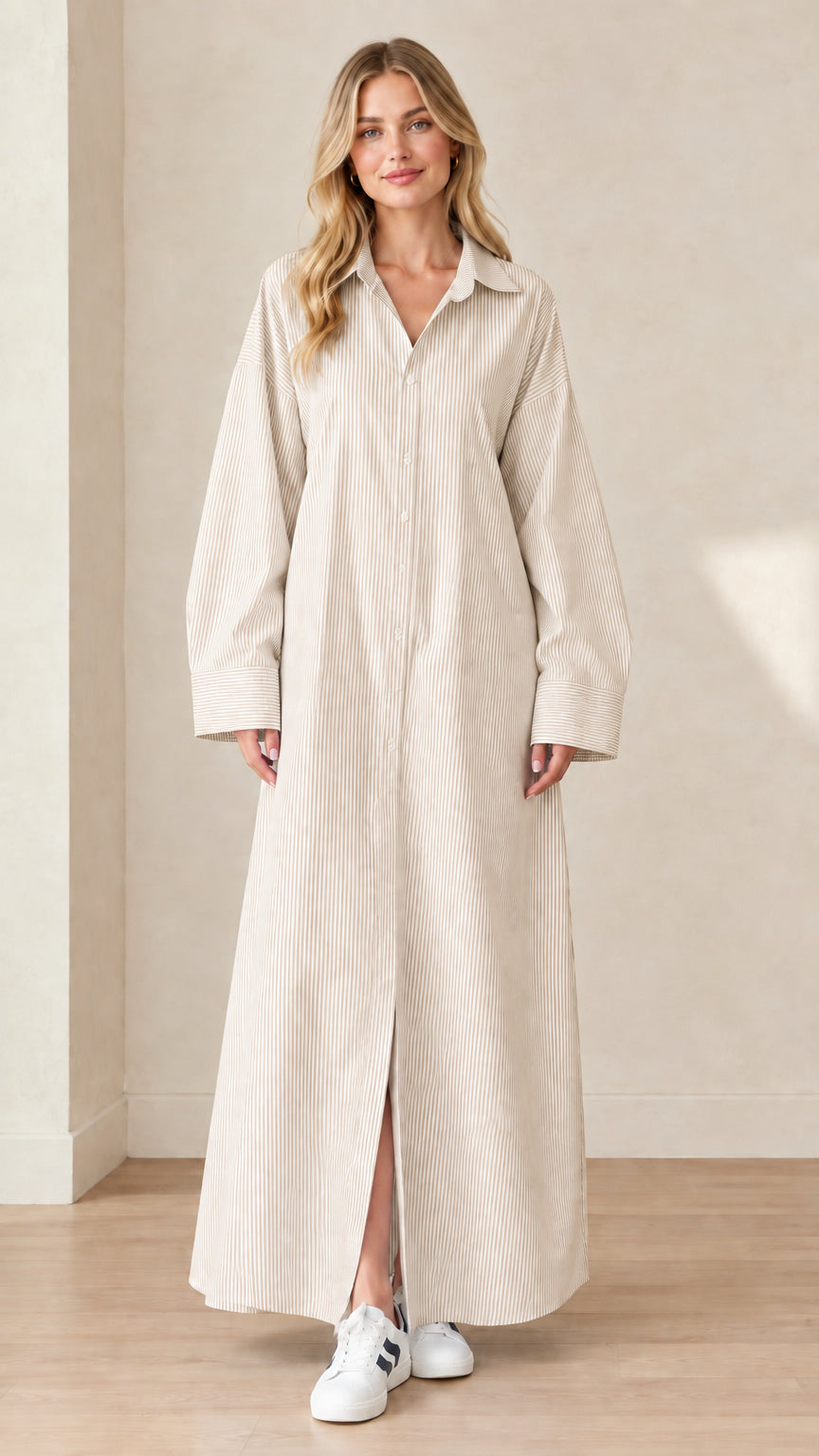 Front view of a model wearing a beige cream and white striped maxi shirt dress