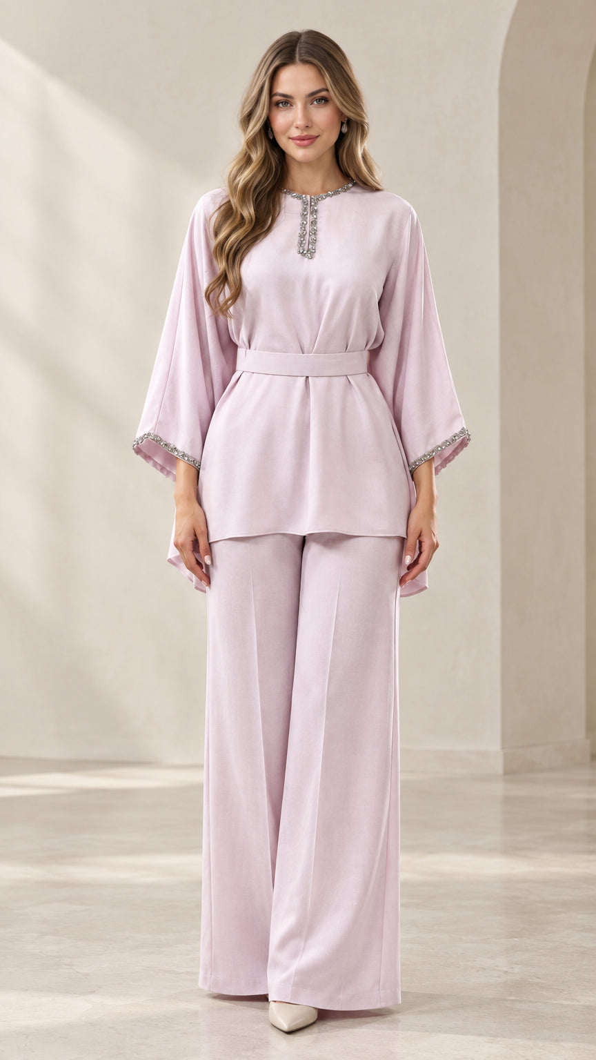 Front full-length view of model wearing lilac rhinestone-embellished tunic top and wide-leg trousers