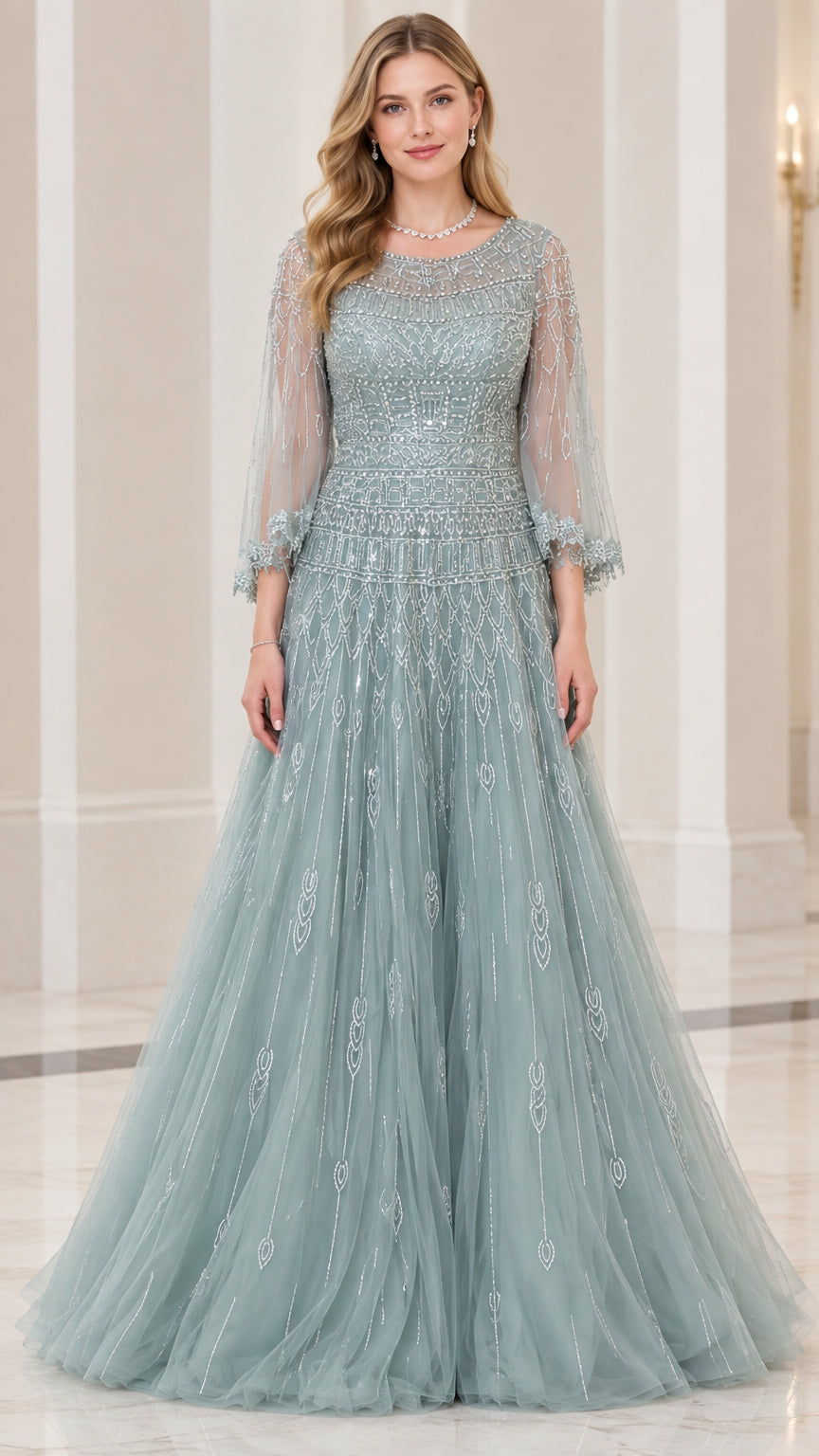 Front view of woman wearing dusty blue beaded tulle A-line evening gown with 3/4 illusion sleeves