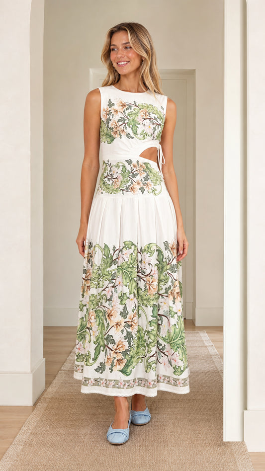 Front view of woman wearing white floral print cutout maxi dress