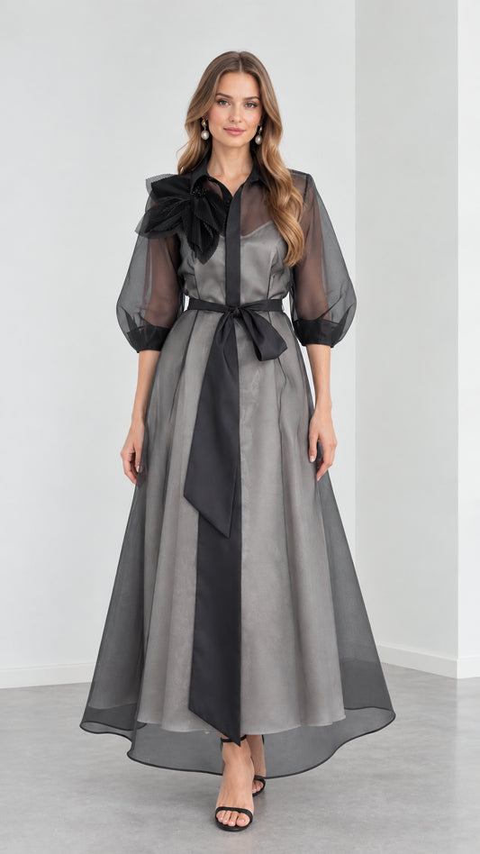 Full front view of model wearing Charcoal Grey organza collared maxi shirt dress with black sash and 3D floral shoulder detail