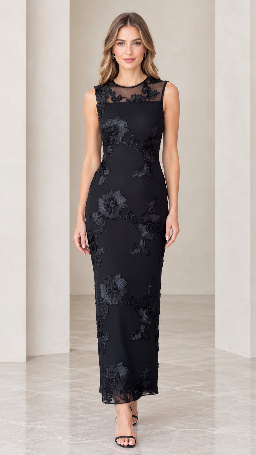 Front view of model wearing black floral appliqué sleeveless column maxi dress