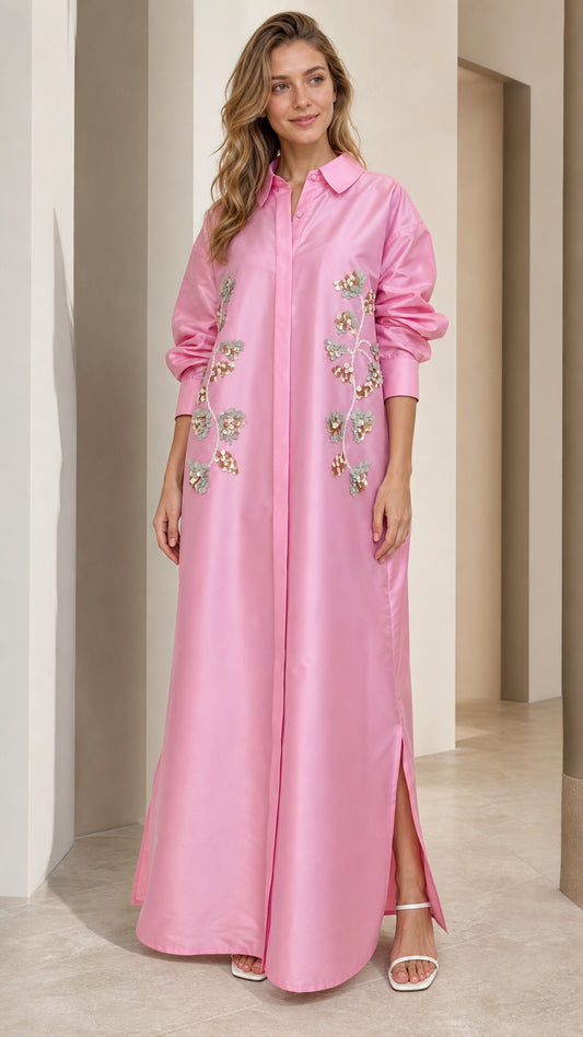 Front full view of woman wearing pink sequin embroidered maxi shirt dress