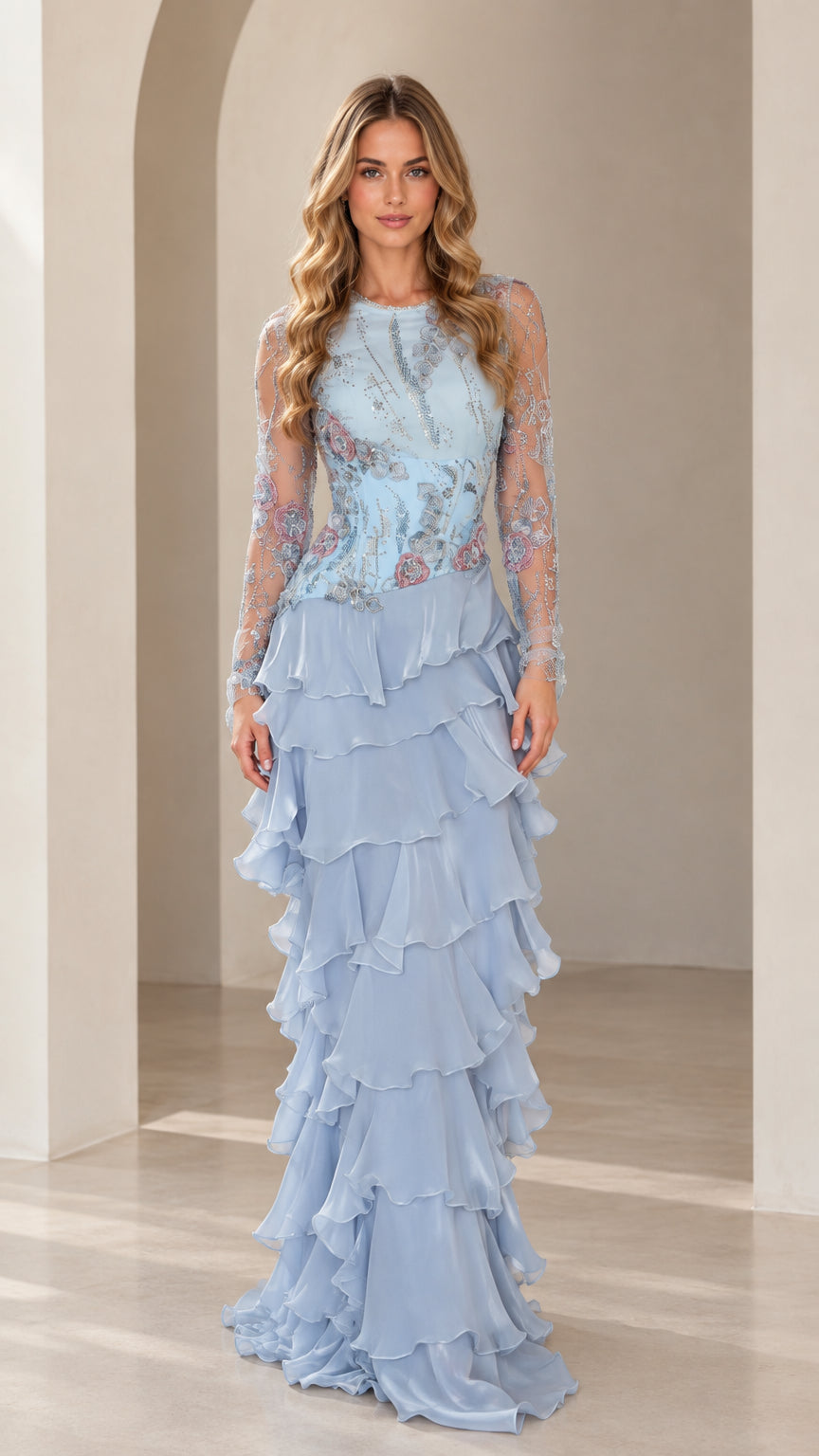 Front view of model wearing Sky Blue embroidered illusion long sleeve tiered ruffle maxi gown