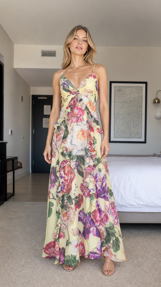 Front view of model wearing yellow floral print ruffle maxi dress