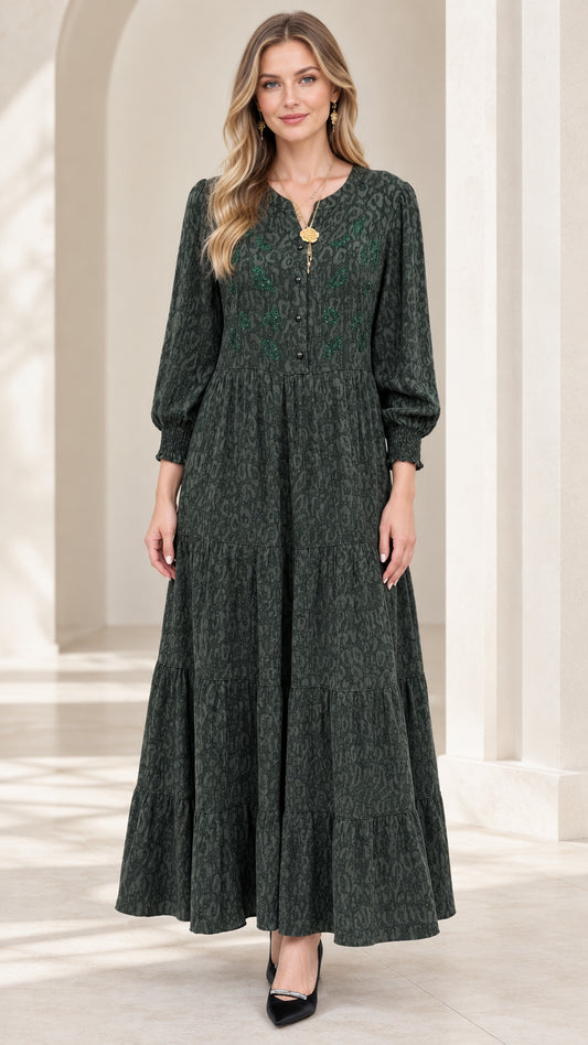 Front view of model wearing dark green embroidered tiered jacquard maxi dress