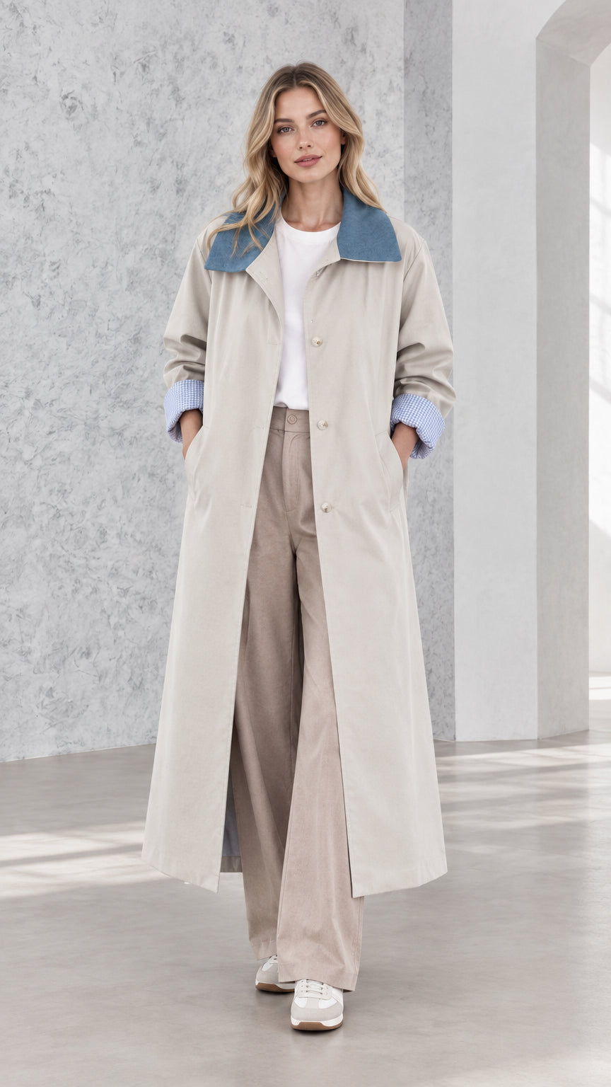 Front view of model wearing light grey contrast collar longline trench coat with wide-leg pants