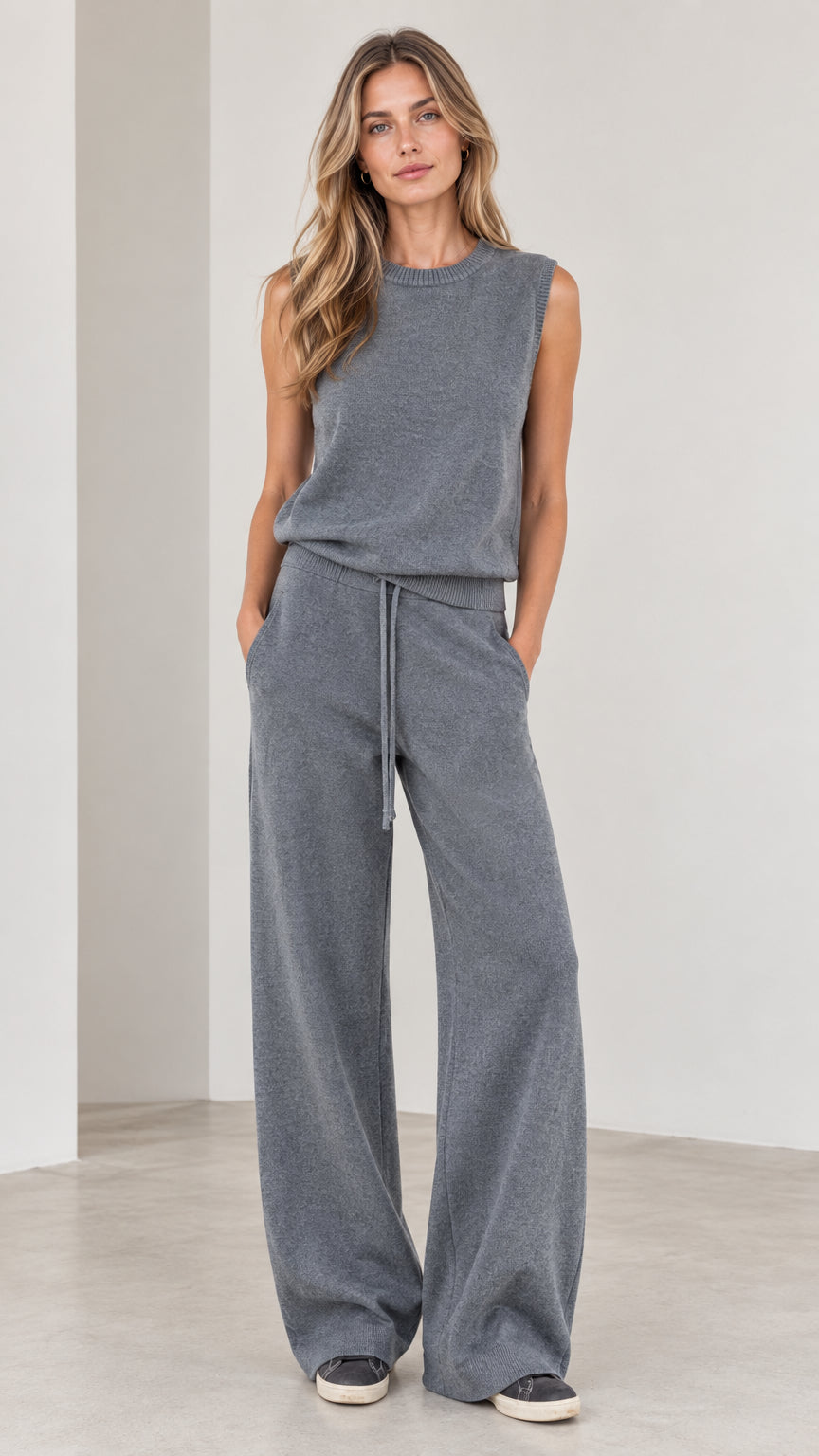 Front view of woman wearing Slate Grey sleeveless knit top and matching wide-leg trousers