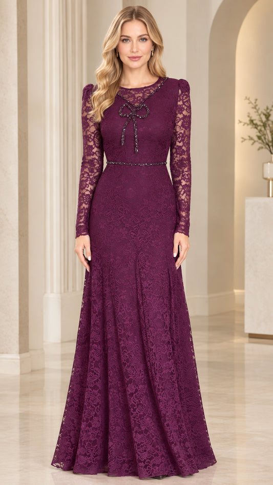 Full front view of model wearing plum floral lace long sleeve evening gown with rhinestone bow accent