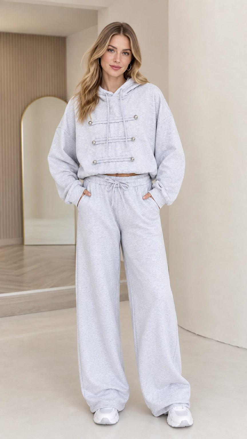 Front full-body view of model wearing light grey cropped hoodie and wide leg pants set