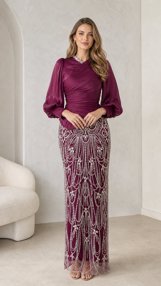Front view of burgundy long sleeve embellished evening dress