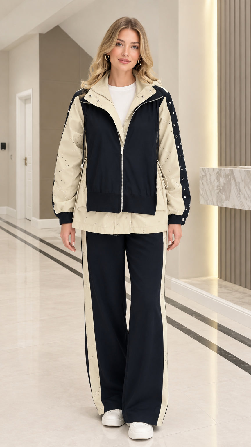 Front view of woman wearing Black colorblock hooded zip jacket and wide leg tracksuit set