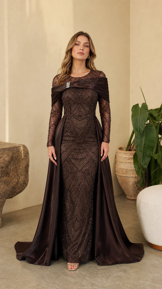Full front view of model wearing Chocolate Brown sequin evening gown with draped satin overskirt