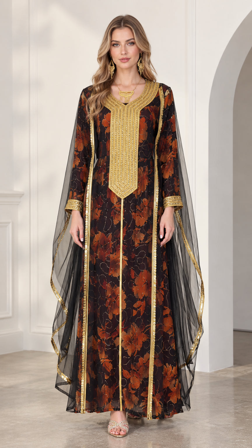 Front view of model wearing black floral kaftan maxi dress with gold embroidered neckline and sheer cape sleeves