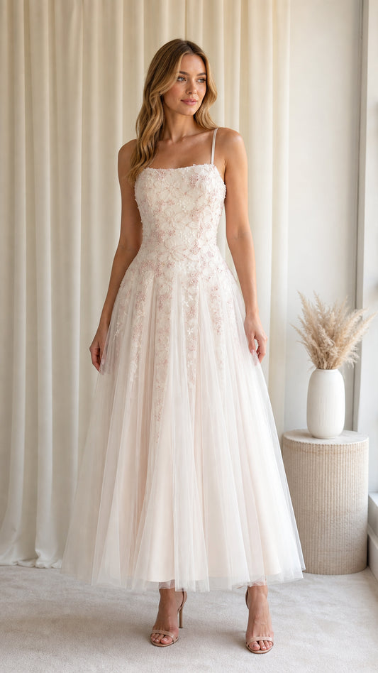 Front view of model wearing Blush Ivory floral embroidered tulle midi dress with spaghetti straps