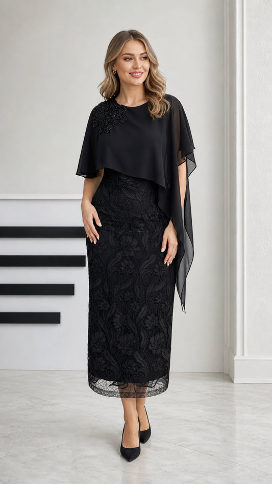 Front view of black embroidered lace midi dress with chiffon cape overlay