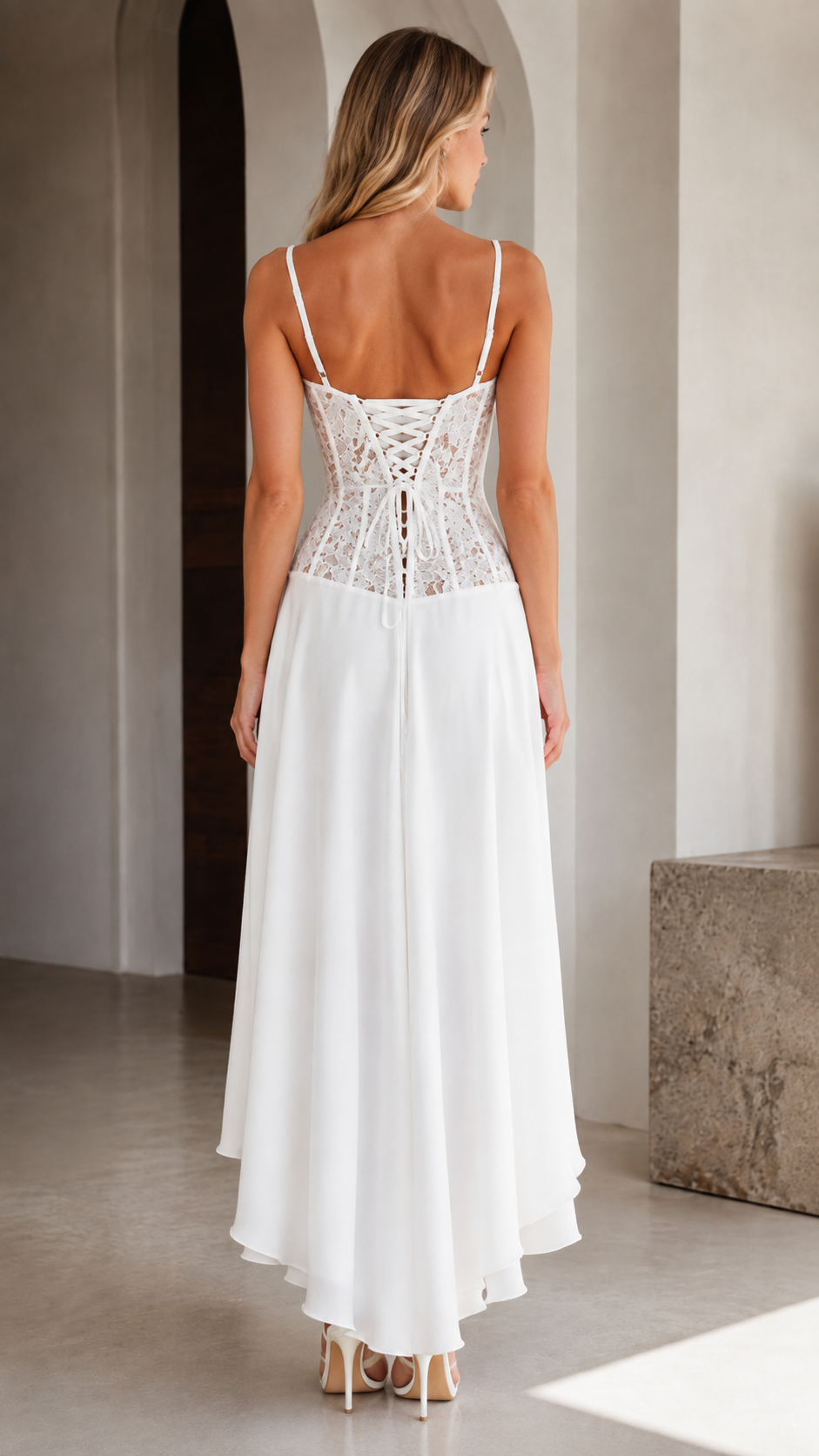 Back view of white lace bodice high-low maxi dress