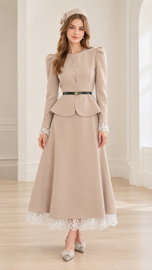 Front view of woman wearing beige vintage peplum jacket and lace-trimmed maxi skirt set with belt