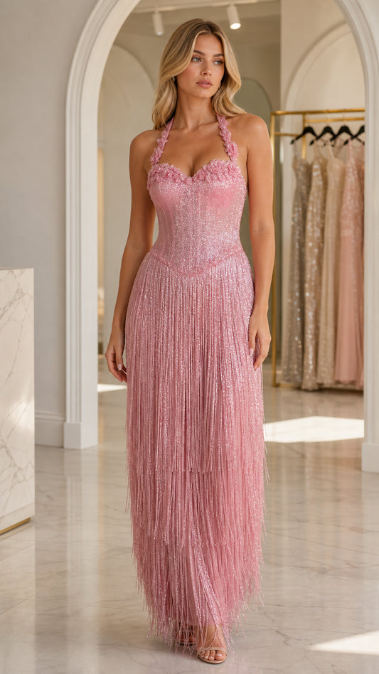Front view of model wearing pink glitter sequin halter fringe evening dress
