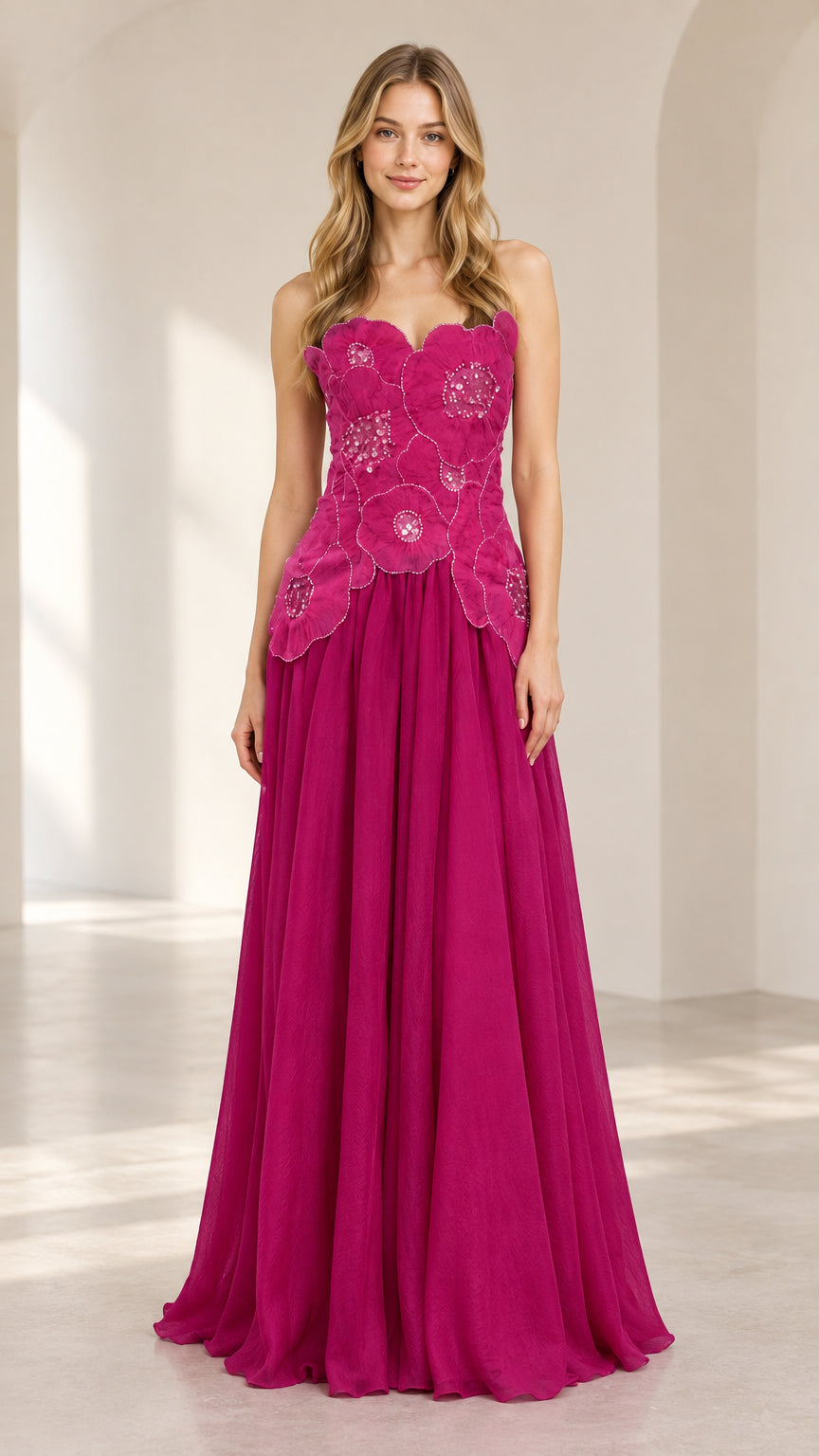 Front view of model wearing magenta strapless 3D floral chiffon evening gown