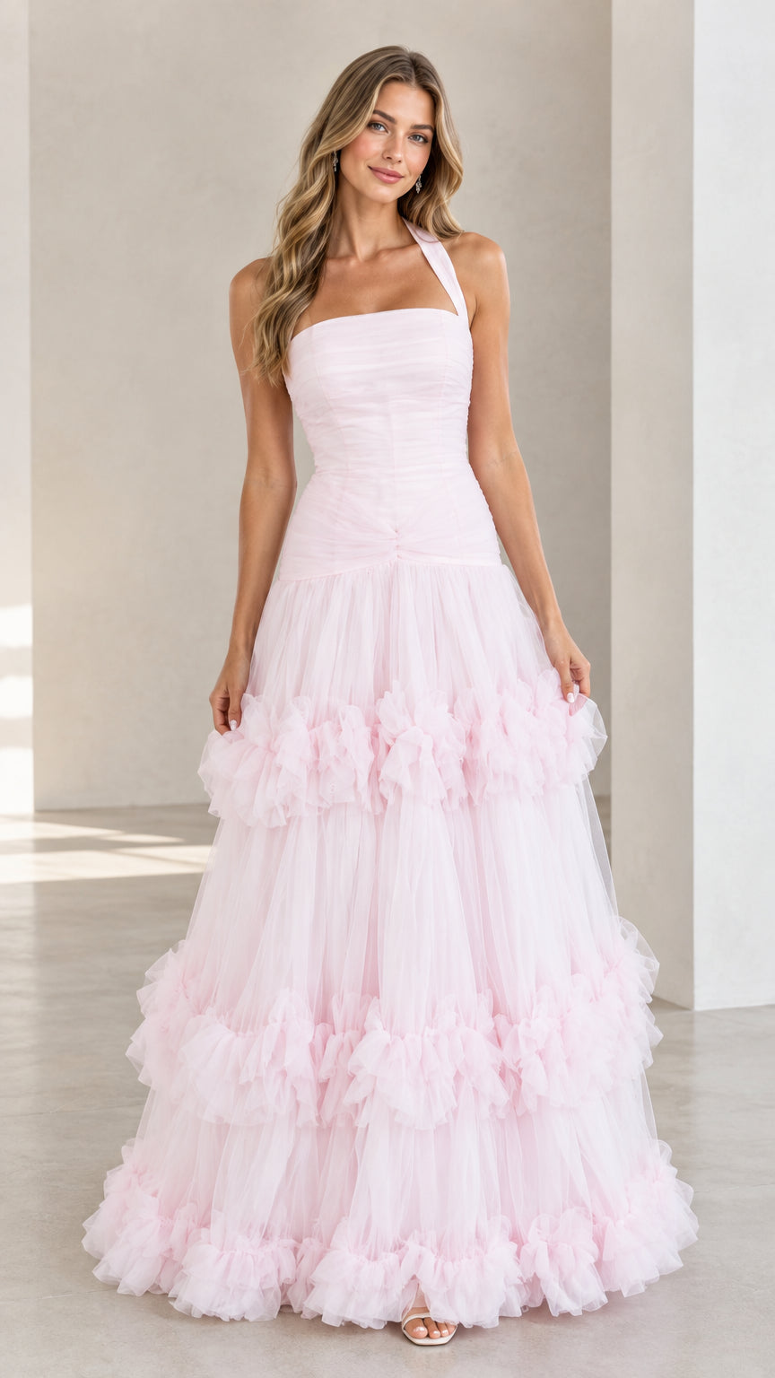 Front view of woman wearing Light Pink halter neck tiered tulle ruffle evening gown