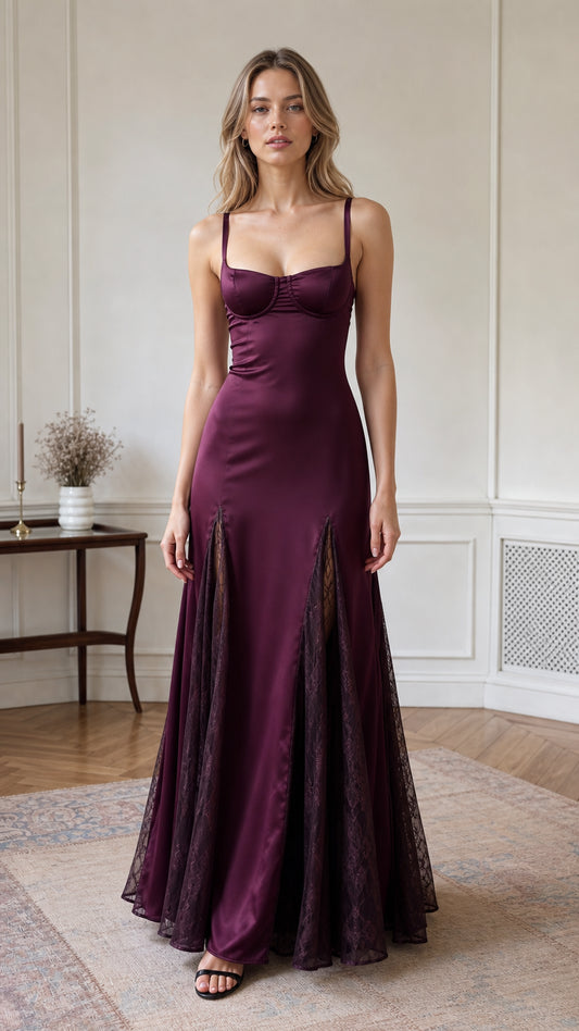 Front view of model wearing burgundy satin bustier maxi dress with lace inserts