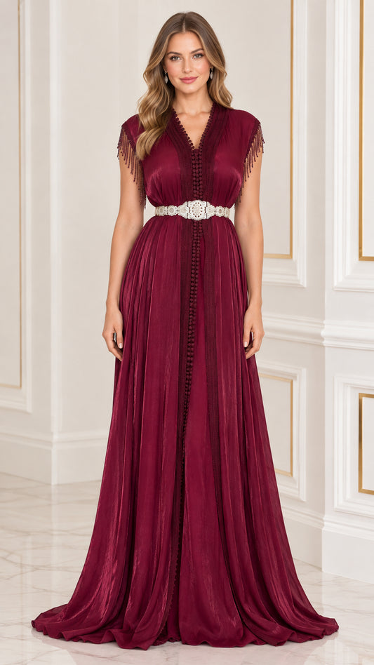 Burgundy pleated kaftan maxi dress with crystal embellished belt and fringe sleeves front view