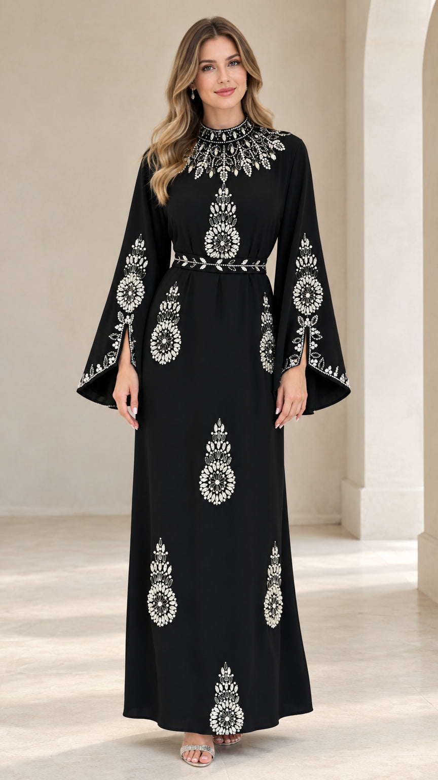 Front full view of woman wearing black rhinestone embellished split bell sleeve maxi dress