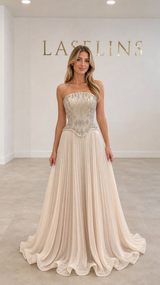 Champagne strapless beaded corset maxi evening gown with pleated skirt front view