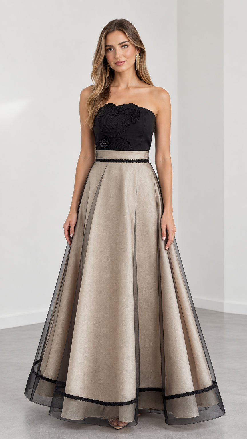 Model wearing Champagne and black strapless embroidered A-line evening gown front view