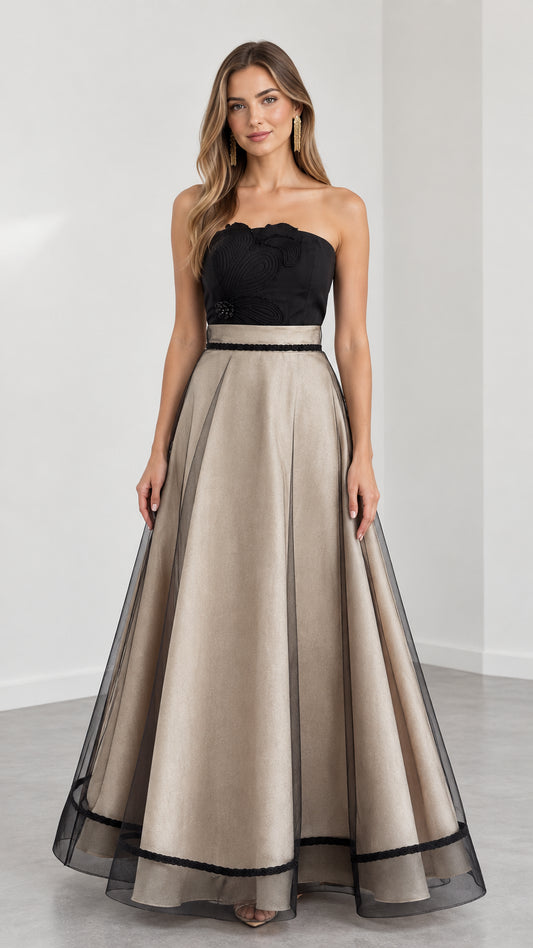 Model wearing Champagne and black strapless embroidered A-line evening gown front view