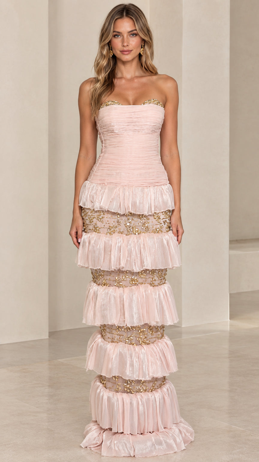 Front view of model wearing Blush Pink strapless tiered evening gown with gold embroidery