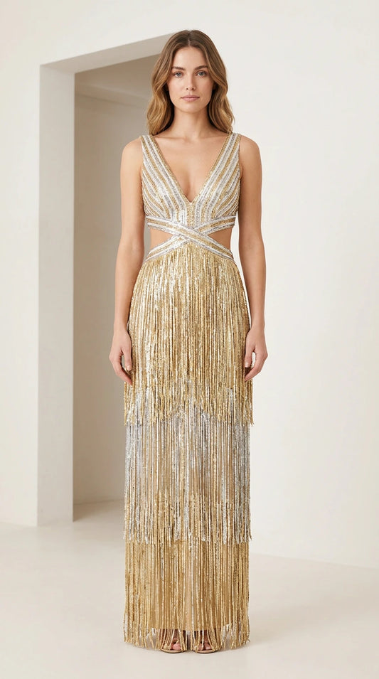 Front view of model wearing gold tiered metallic fringe maxi dress with deep V-neck and cutouts