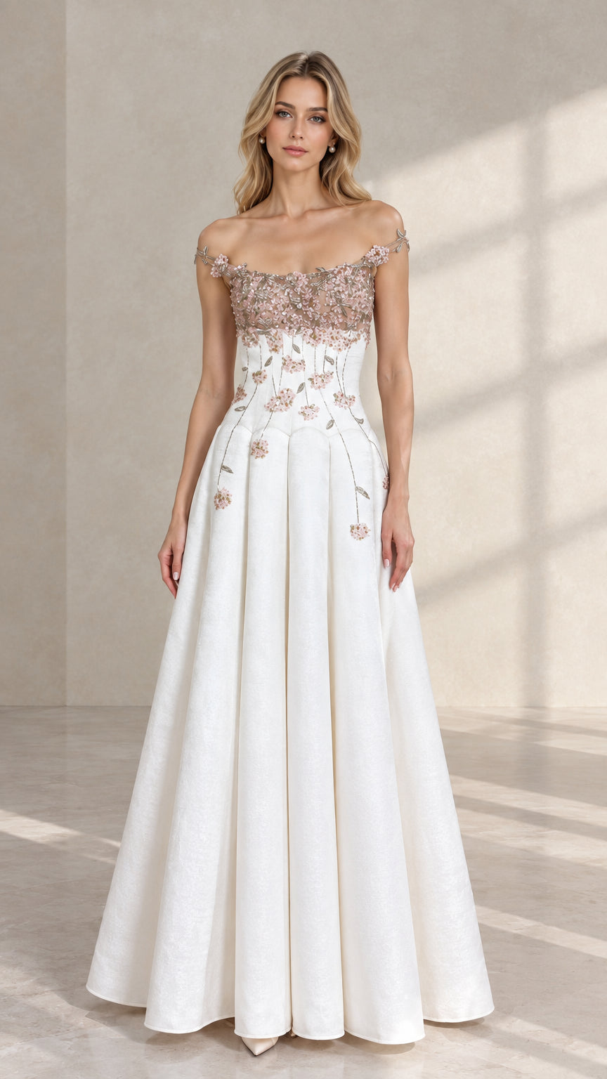 Front view of model wearing white off-the-shoulder A-line evening gown with pink 3D floral appliques