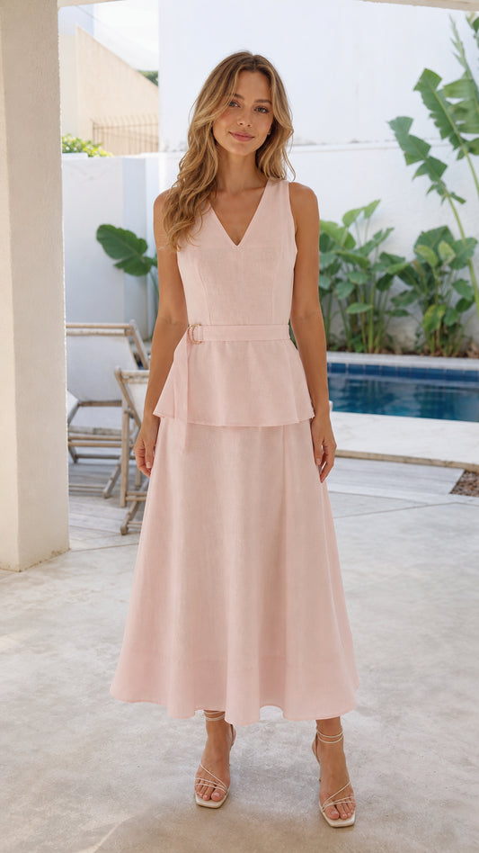 Woman wearing pink V-neck peplum midi dress from the front