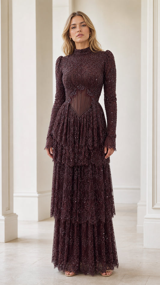 Front view of model wearing burgundy long sleeve embellished corset tiered evening maxi dress