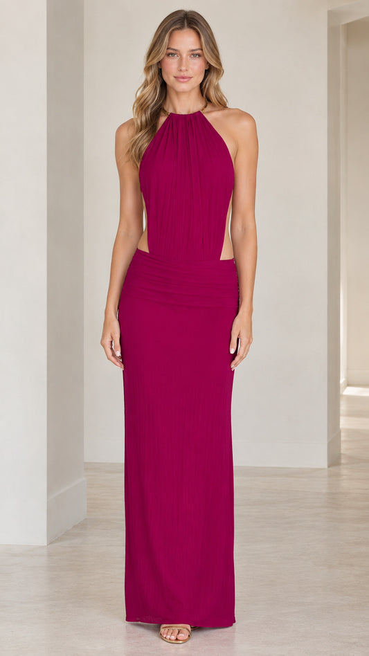 Front full-length view of model wearing the magenta halter neck cutout maxi dress