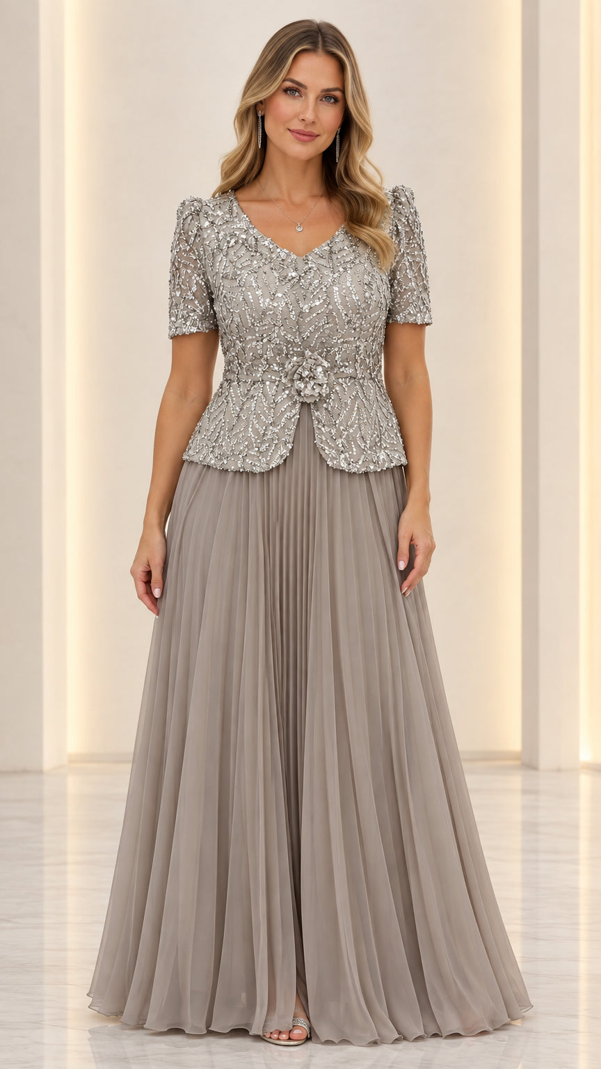Full front view of slate grey sequin peplum evening gown with pleated skirt