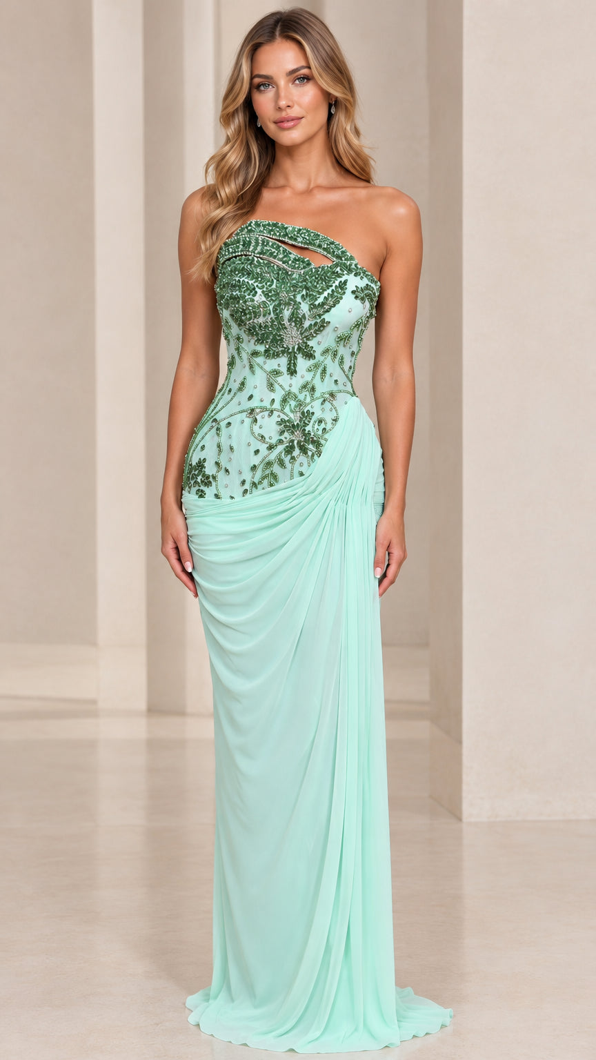 Front view of model wearing mint green asymmetrical beaded cutout evening gown