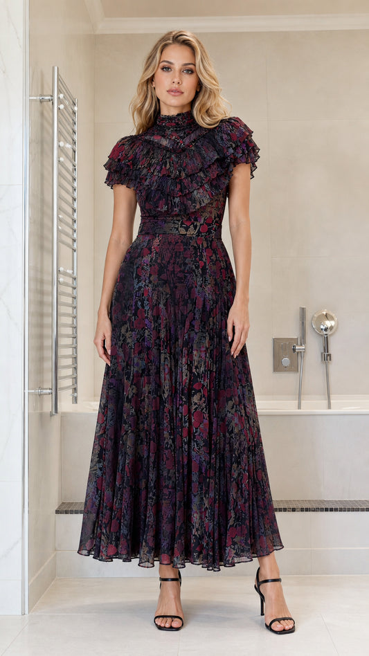 Front view of model wearing dark multi ruffled high-neck pleated maxi dress