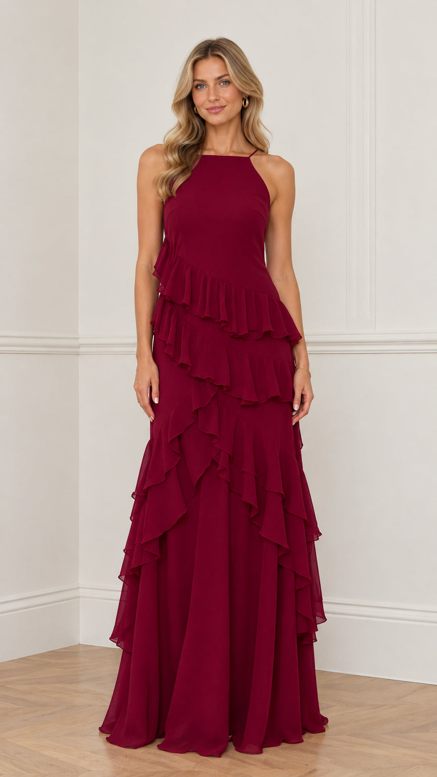 Front view of model wearing burgundy halter neck tiered ruffle maxi dress