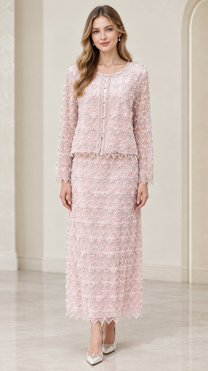 Front full-length view of woman wearing blush pink beaded two-piece maxi skirt suit