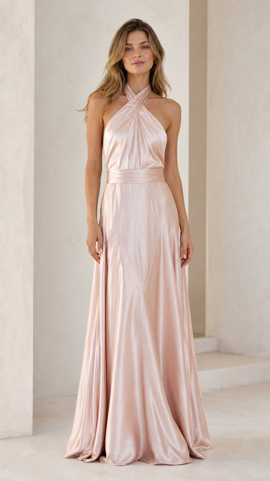 Front view of model wearing Blush Pink halter cross-front satin maxi dress
