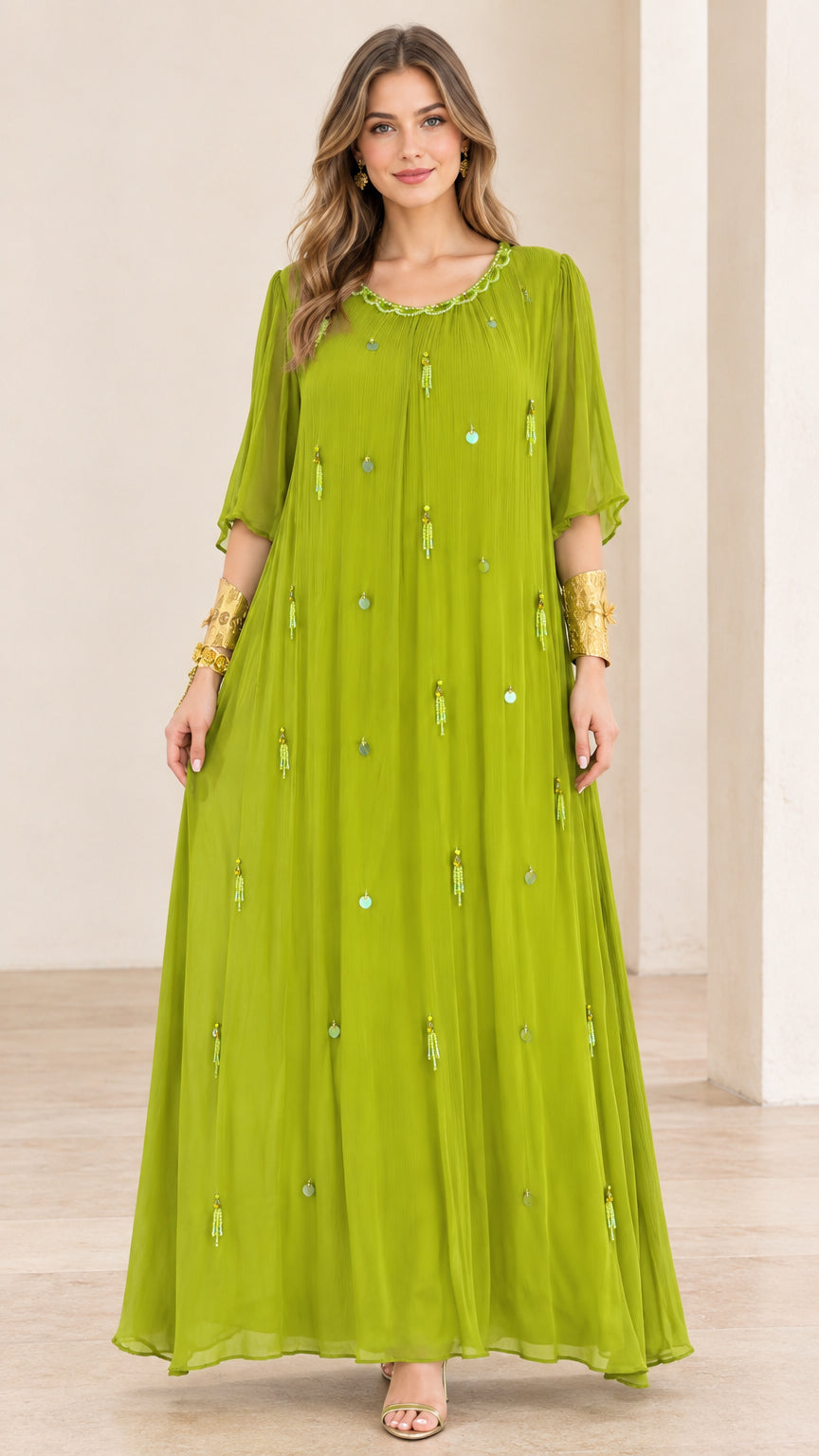 Front full-length view of model wearing lime green pleated chiffon maxi dress with beaded details