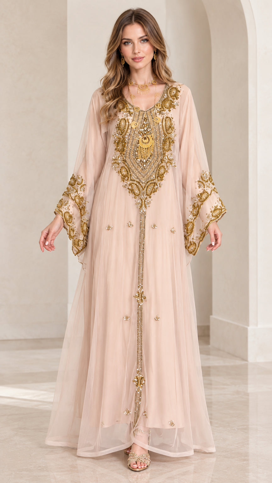 Front view of woman wearing blush pink gold embroidered kaftan maxi dress