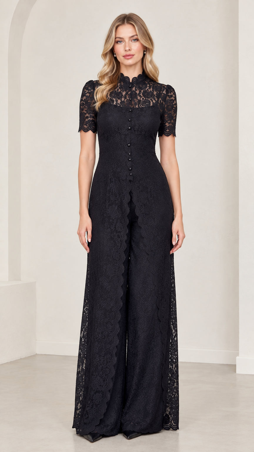 Front full-length view of model wearing black floral lace wide-leg jumpsuit
