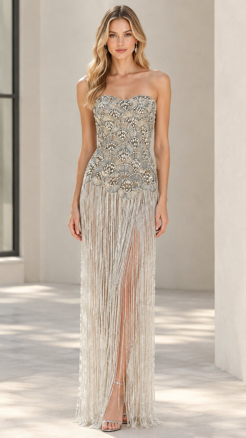 Front view of Champagne strapless beaded fringe evening gown with slit